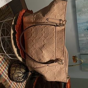 Tan coach tote bag.